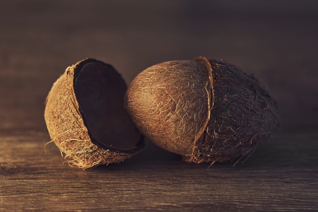 closeup-shot-of-a-broken-coconut-on-the-wooden-tab-2023-11-27-04-50-16-utc-1024×683